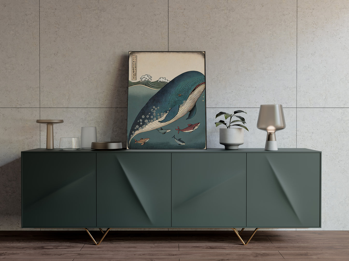 Ukiyo-e whale and fish poster resting on a dark green sideboard against a textured beige wall