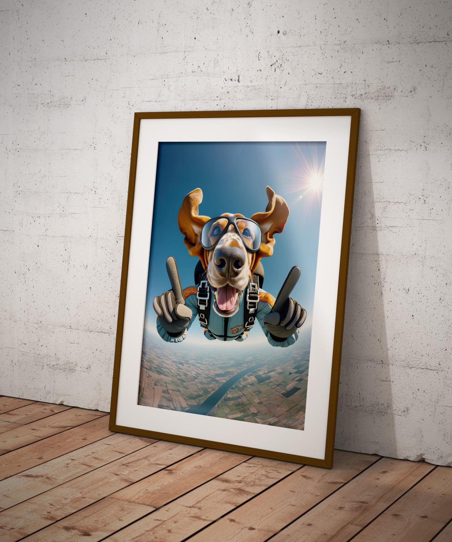 Poster Basset Hound en chute libre, cadre bois foncé et passe-partout, posé au sol contre un mur de briques blanches