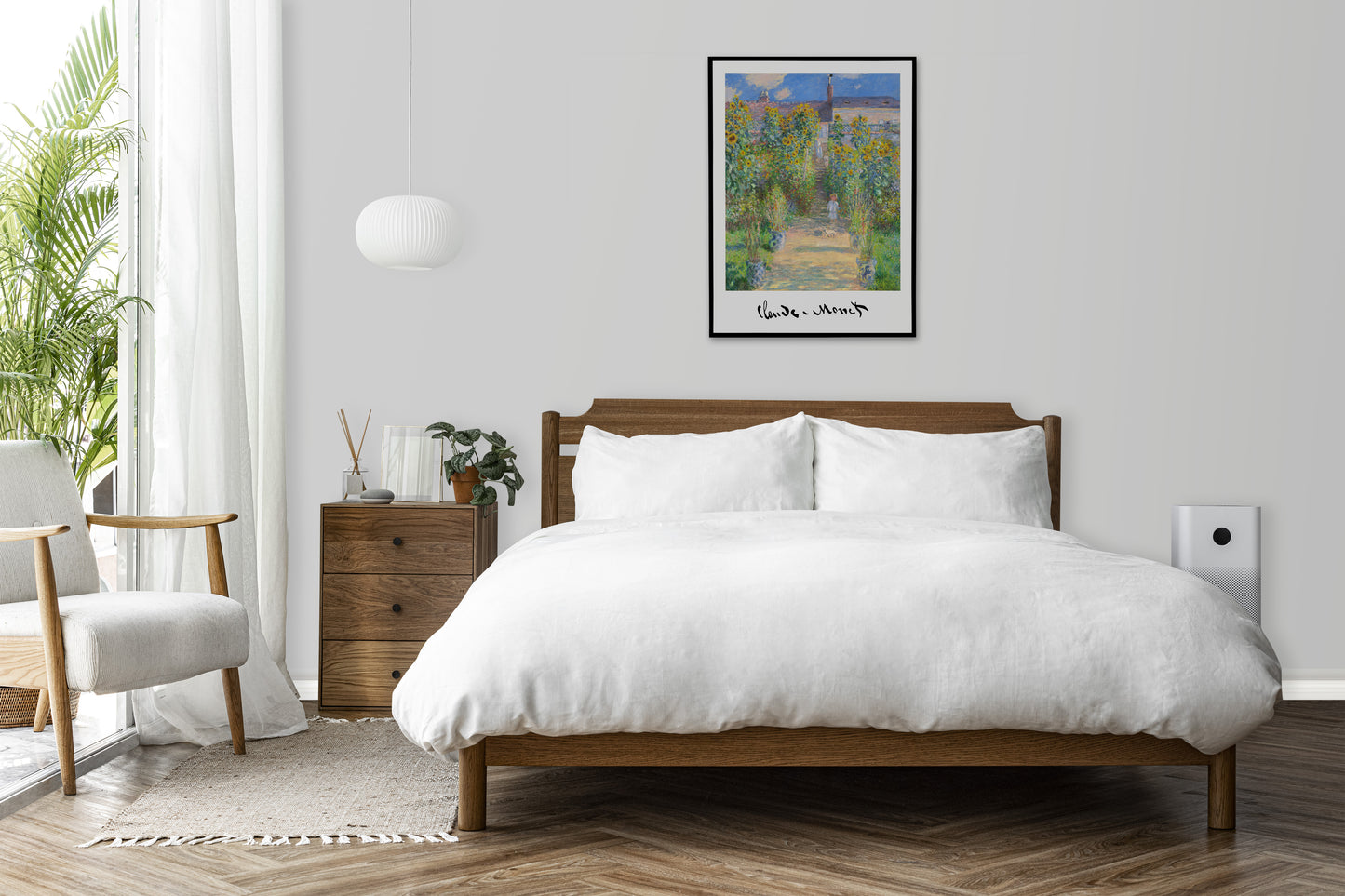 Monet garden at Vetheuil poster in a black frame above a wooden bed in a white bedroom