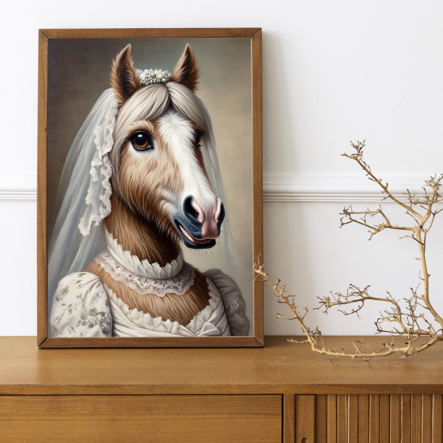 Mare in wedding dress poster in a dark wood frame on a wooden sideboard with a decorative branch