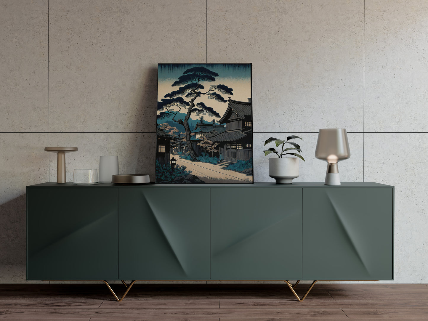 Affiche village japonais bleu posée sur un buffet vert sapin, mur beige texturé