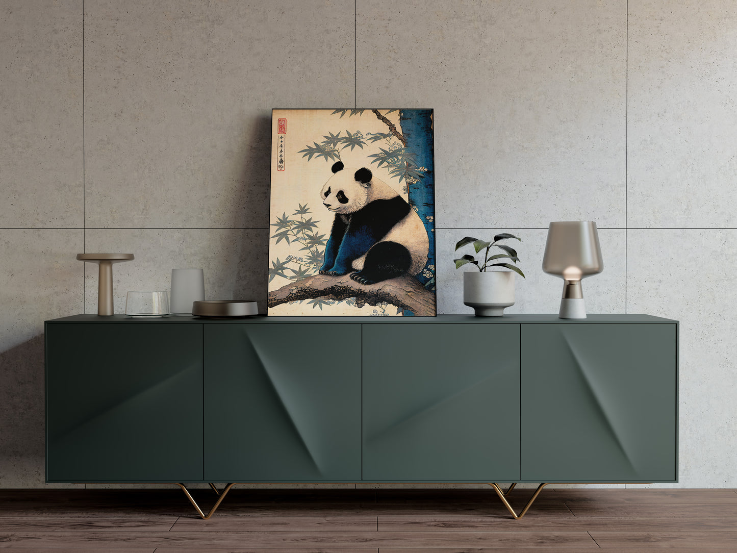 Japanese art panda poster resting on a dark green sideboard with a lamp and vases