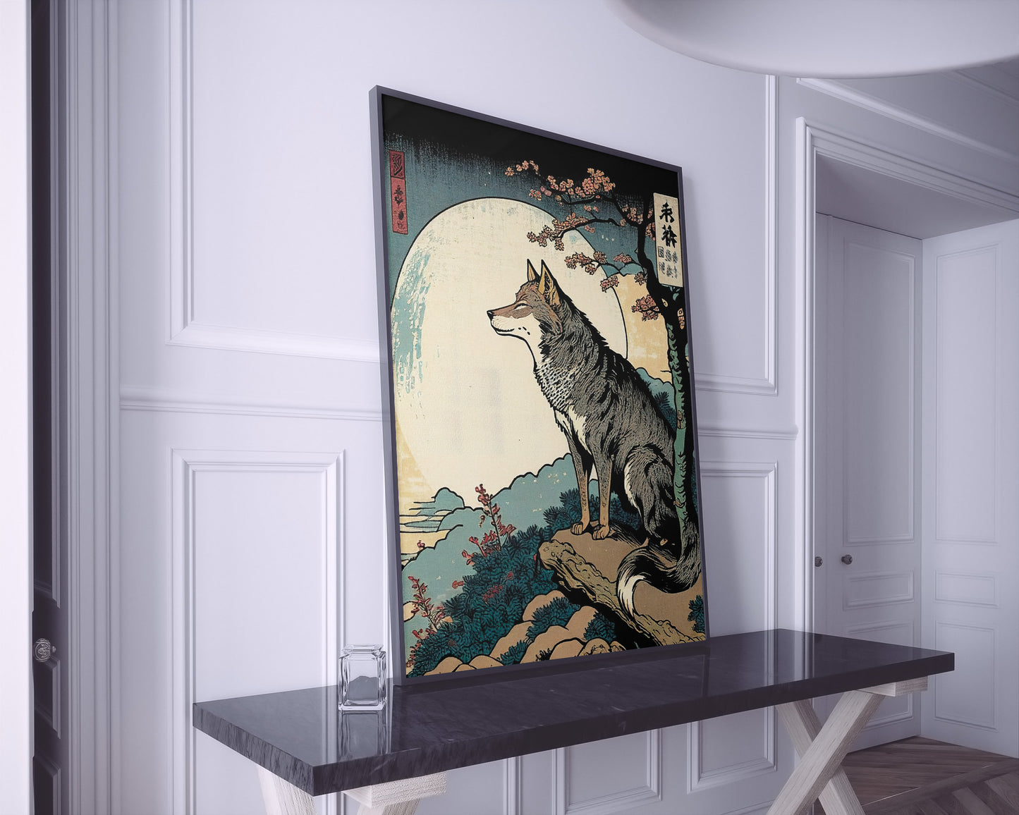 Poster loup style japonais, cadre noir, posé sur une console en marbre noir dans une entrée blanche