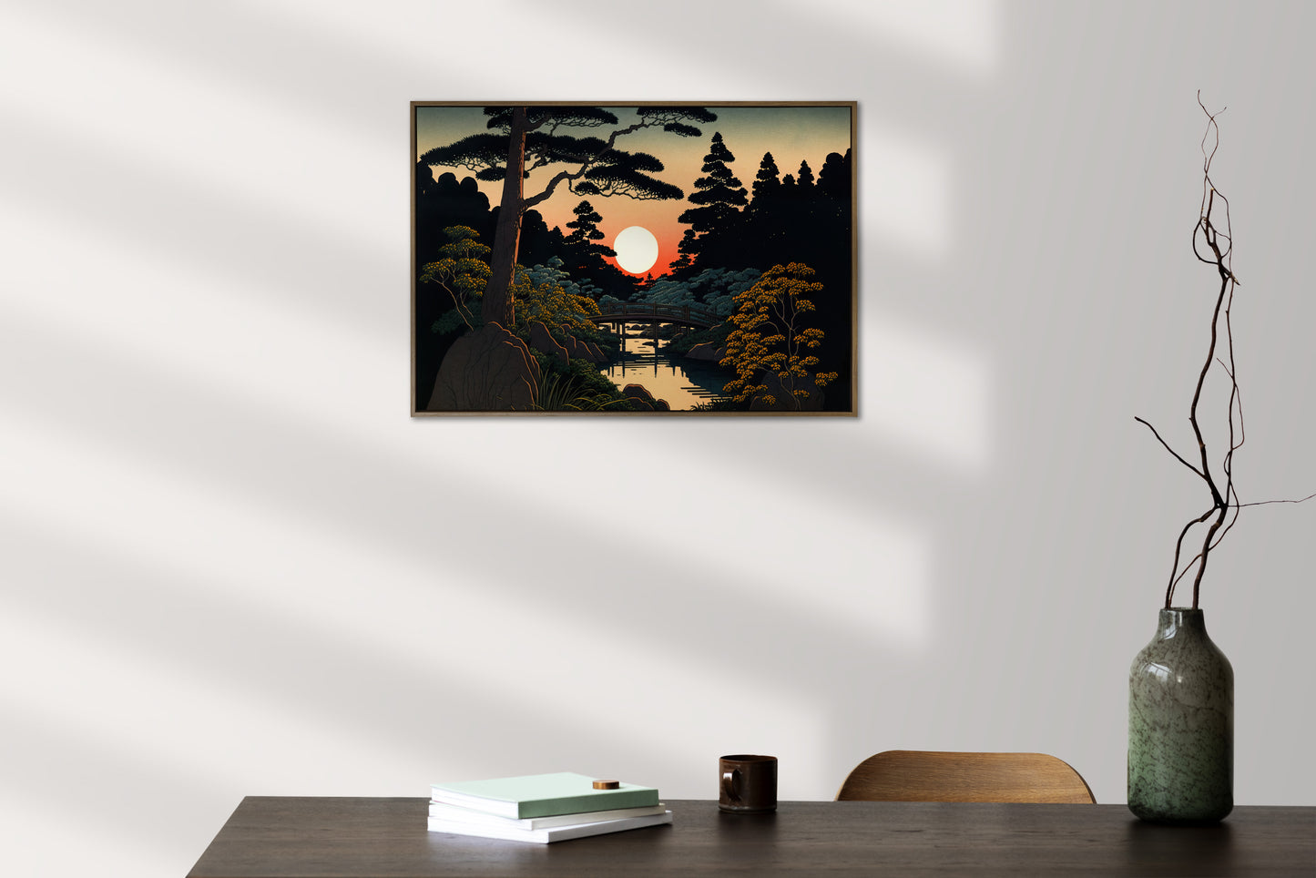 Poster jardin japonais au soleil rouge au-dessus d'une table sombre, vase et branches sèches