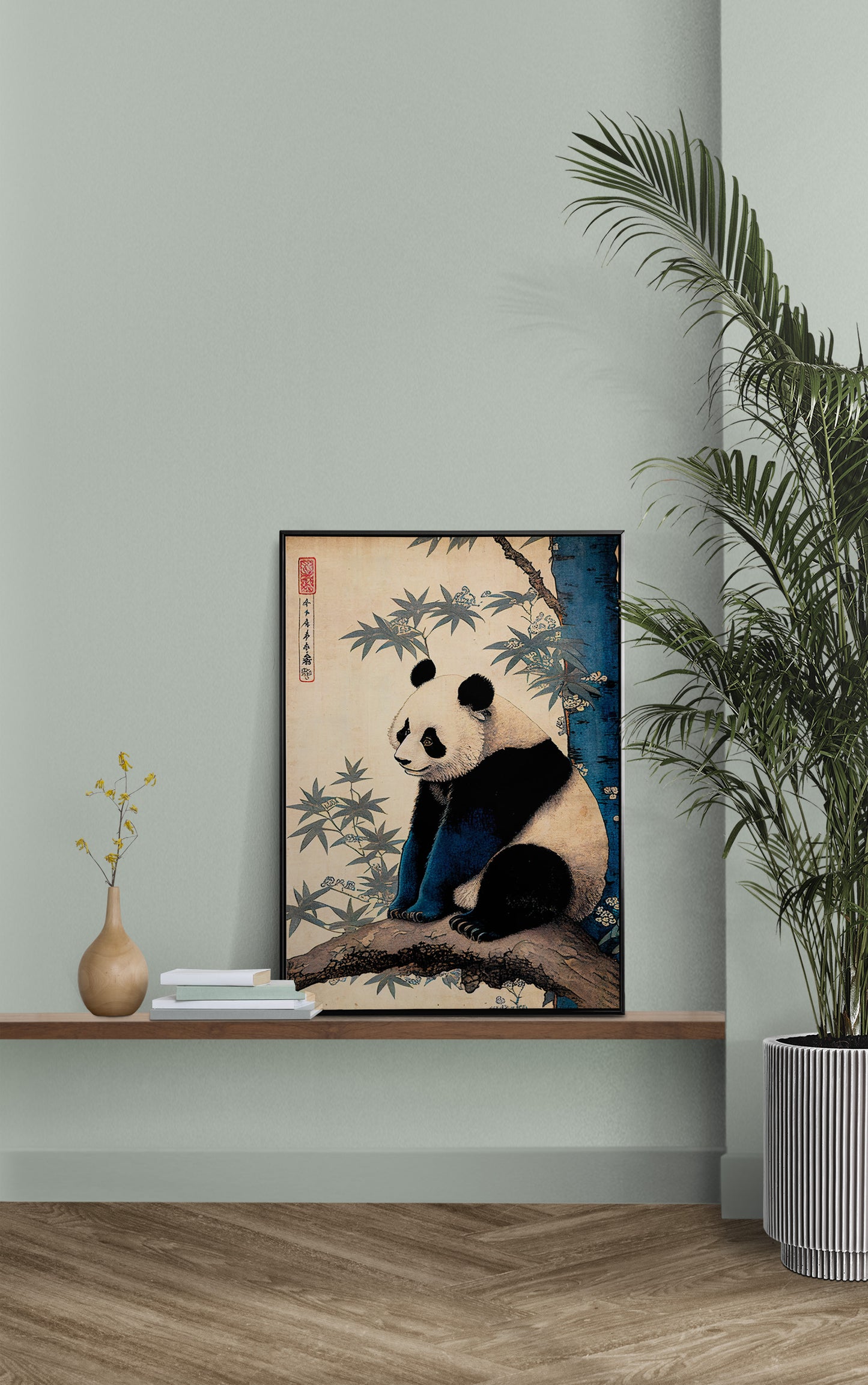 Japanese art panda poster on a wall shelf with a sage green wall and a palm