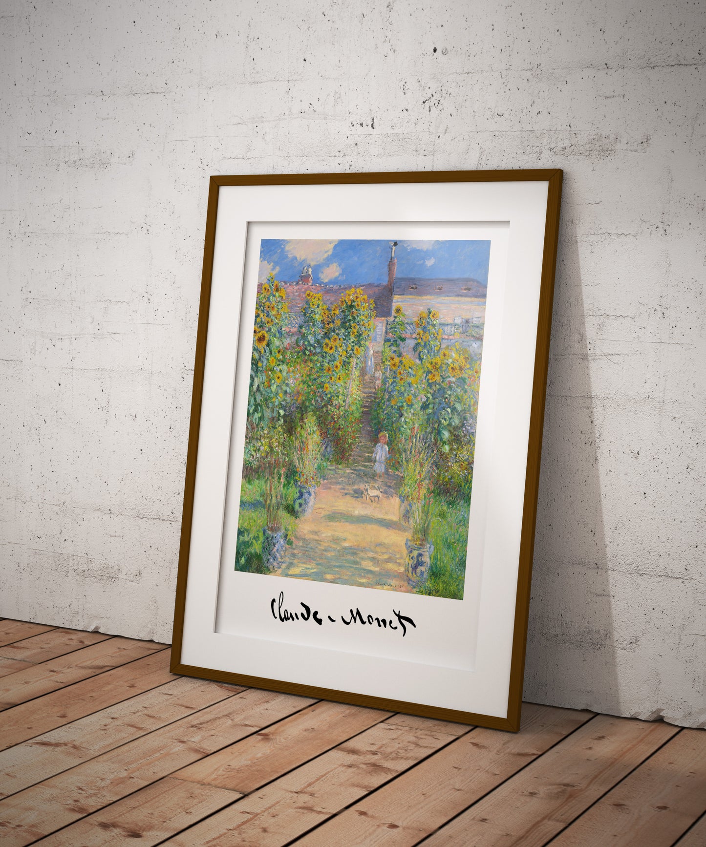Monet poster in a dark wood frame with a mat, leaning on the floor against a white brick wall