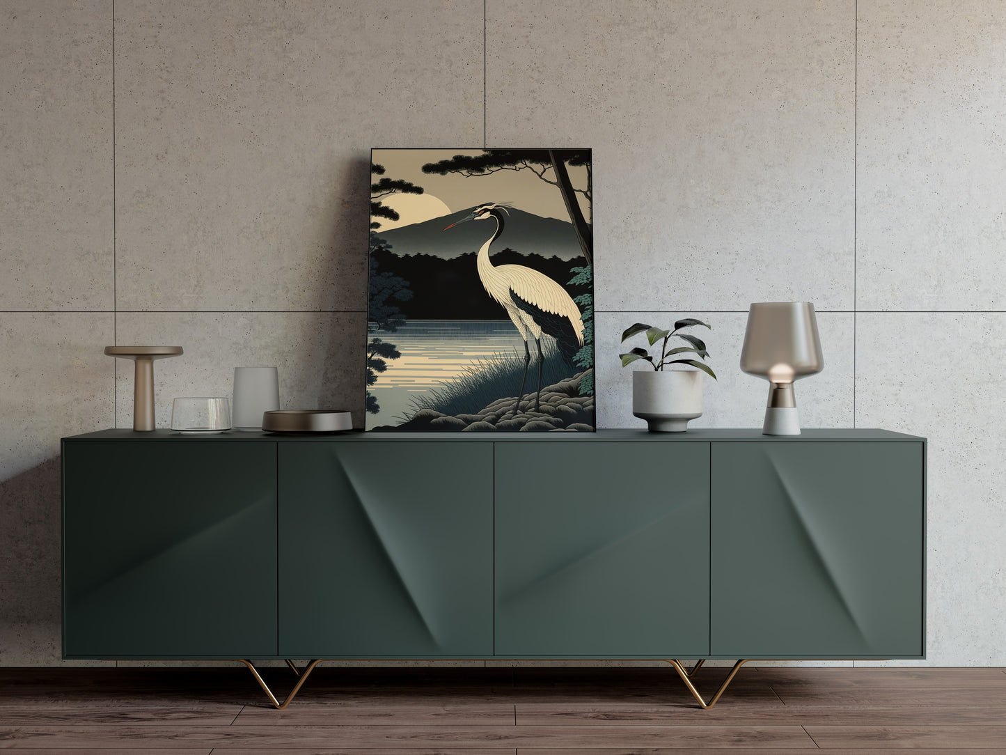 Poster grue du Japon posé sur un buffet vert sauge, lampe et petits objets déco