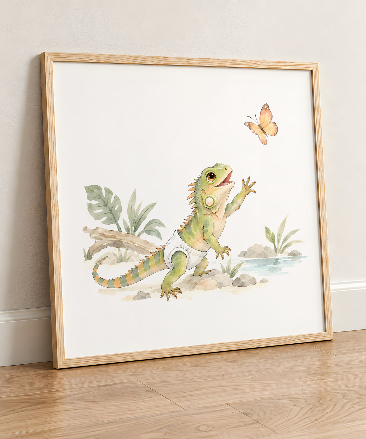 Baby Iguana in a White Diaper Reaches for a Butterfly Among the Leaves: natural wood frame, 50 × 50 cm, styled in a room