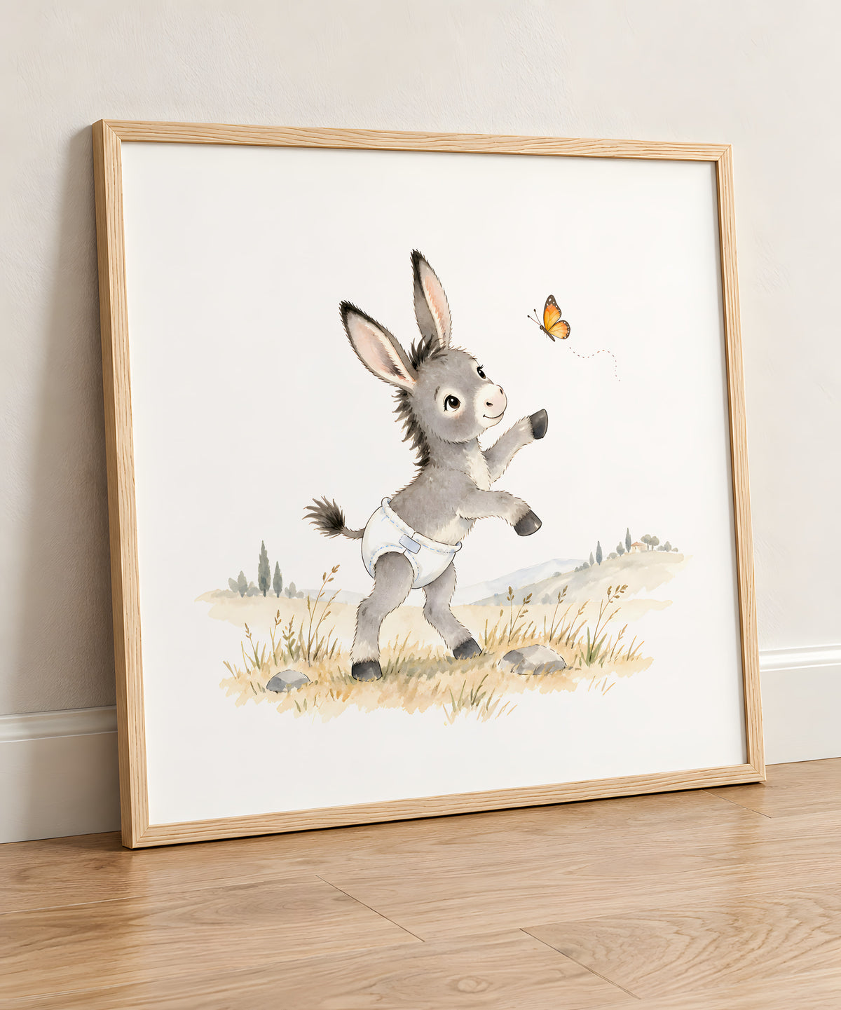 Ânon en couche blanche essayant d’attraper un papillon : cadre bois clair, 50 × 50 cm, en situation