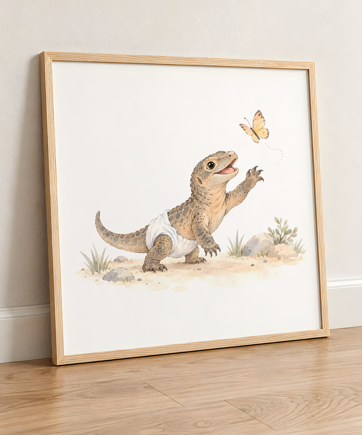 Baby Komodo Dragon in a White Diaper Chases a Butterfly: natural wood frame, 50 × 50 cm, styled in a room