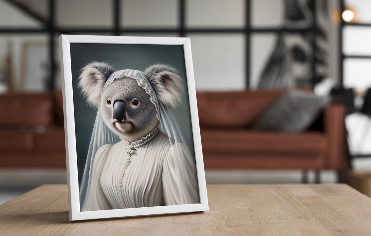 Koala in wedding dress poster in a white frame on a wooden table, blurred living room behind