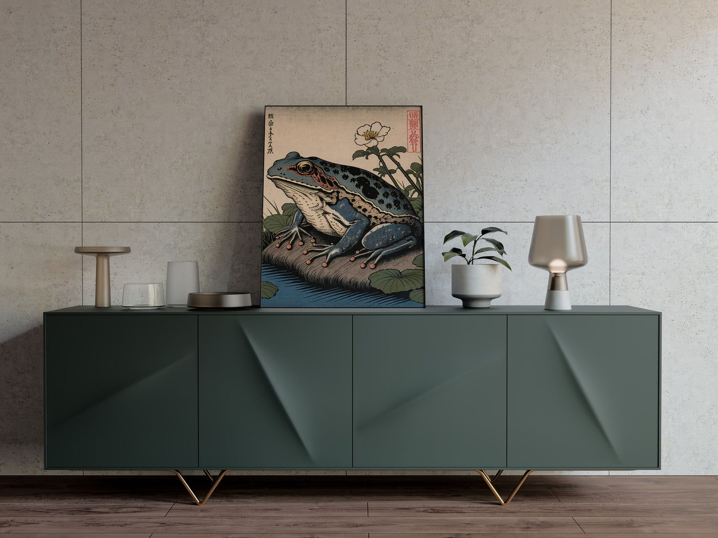 Poster grenouille japonaise posé sur un buffet vert sapin, mur beige texturé