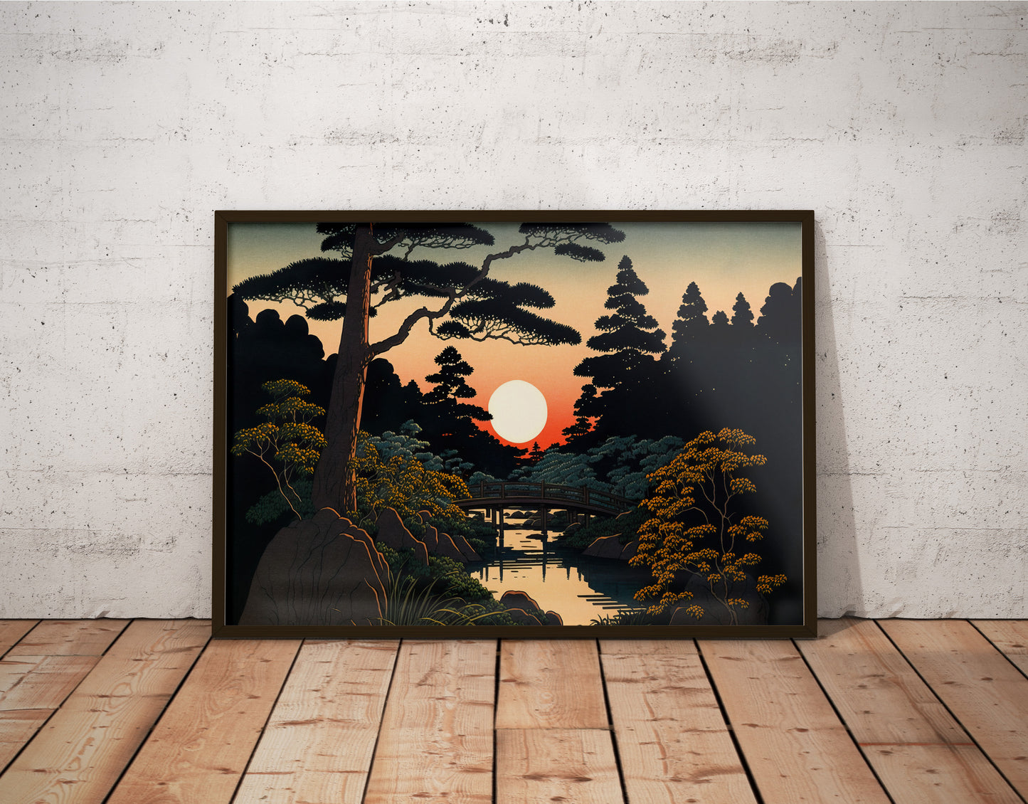 Poster jardin japonais, cadre bois foncé, posé au sol devant un mur de briques blanches