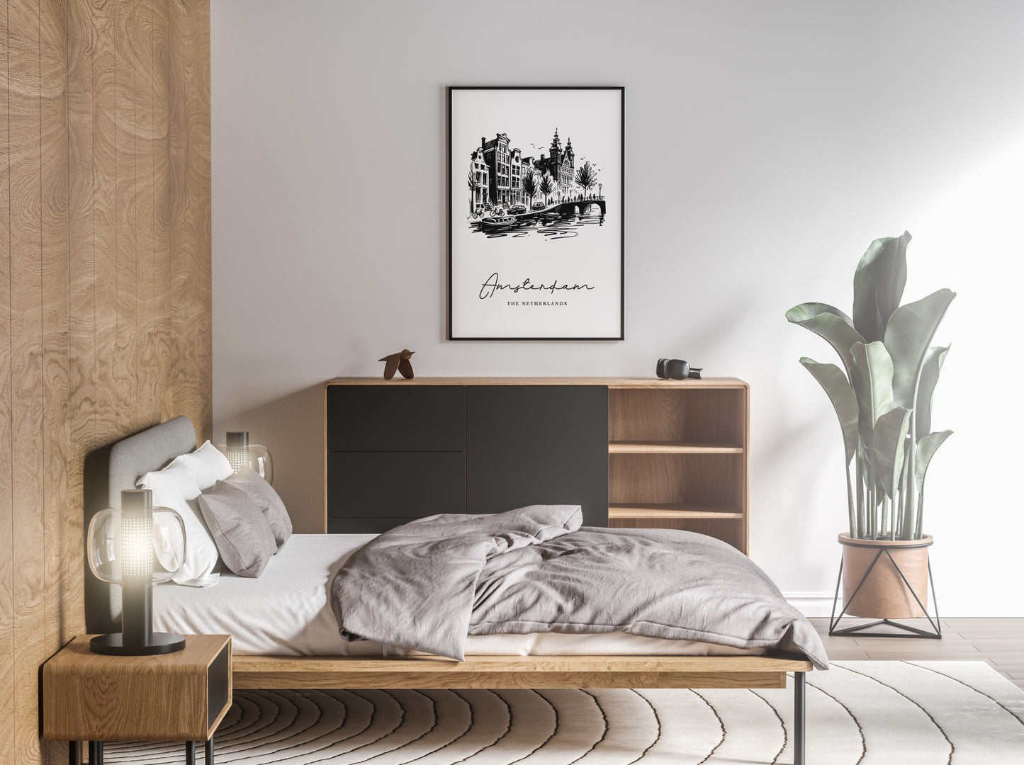 Poster des canaux d'Amsterdam en cadre noir au-dessus d'un lit, chambre aux tons gris et bois