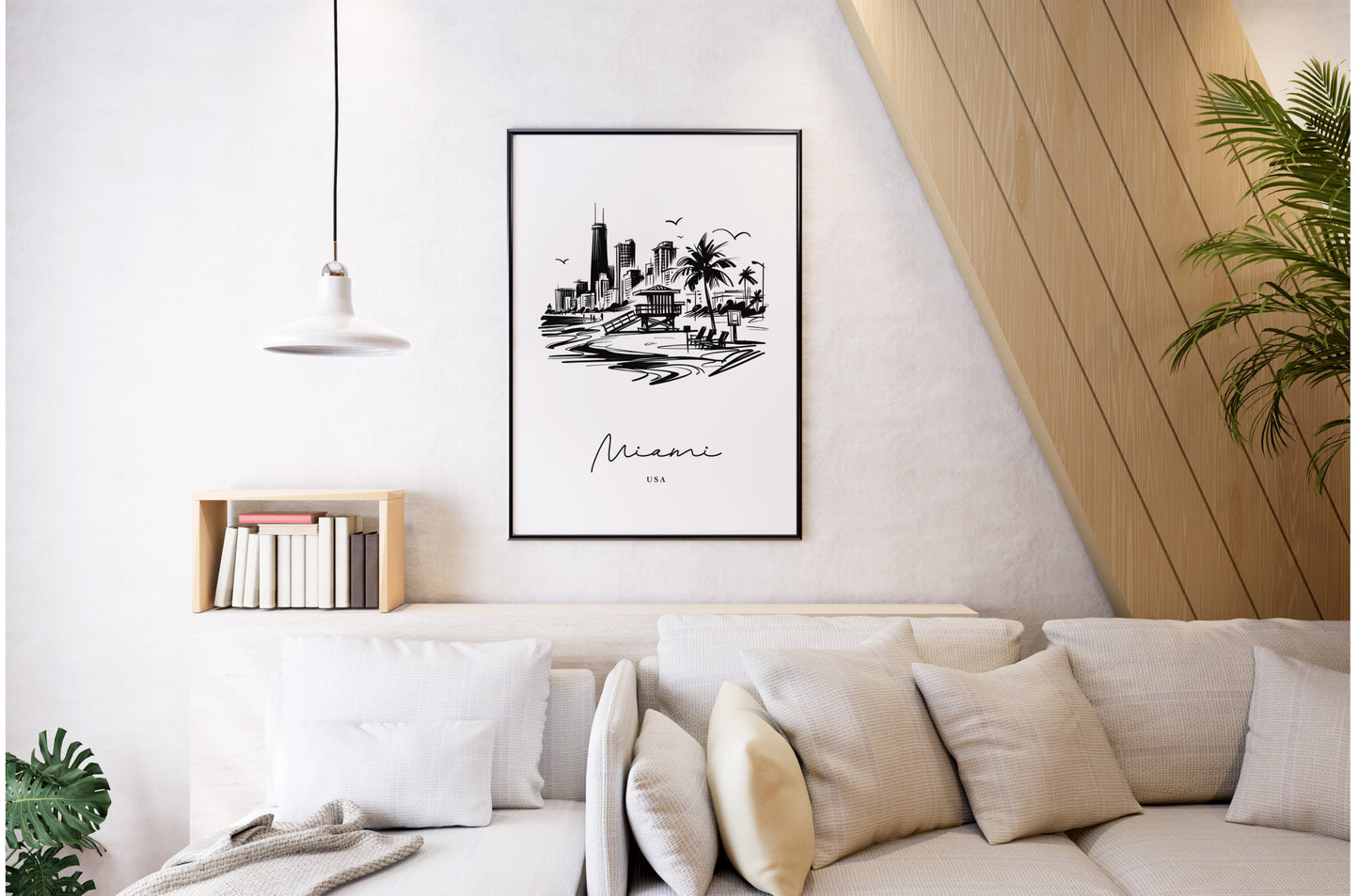 Affiche Miami noir et blanc, cadre noir au mur d'un salon lumineux, canapé blanc et coussins beiges
