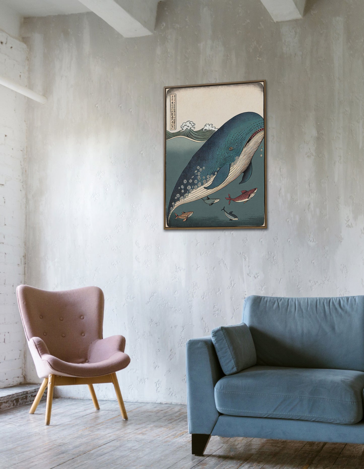 Ukiyo-e whale and fish poster hung on a concrete wall above a pink armchair and a blue sofa