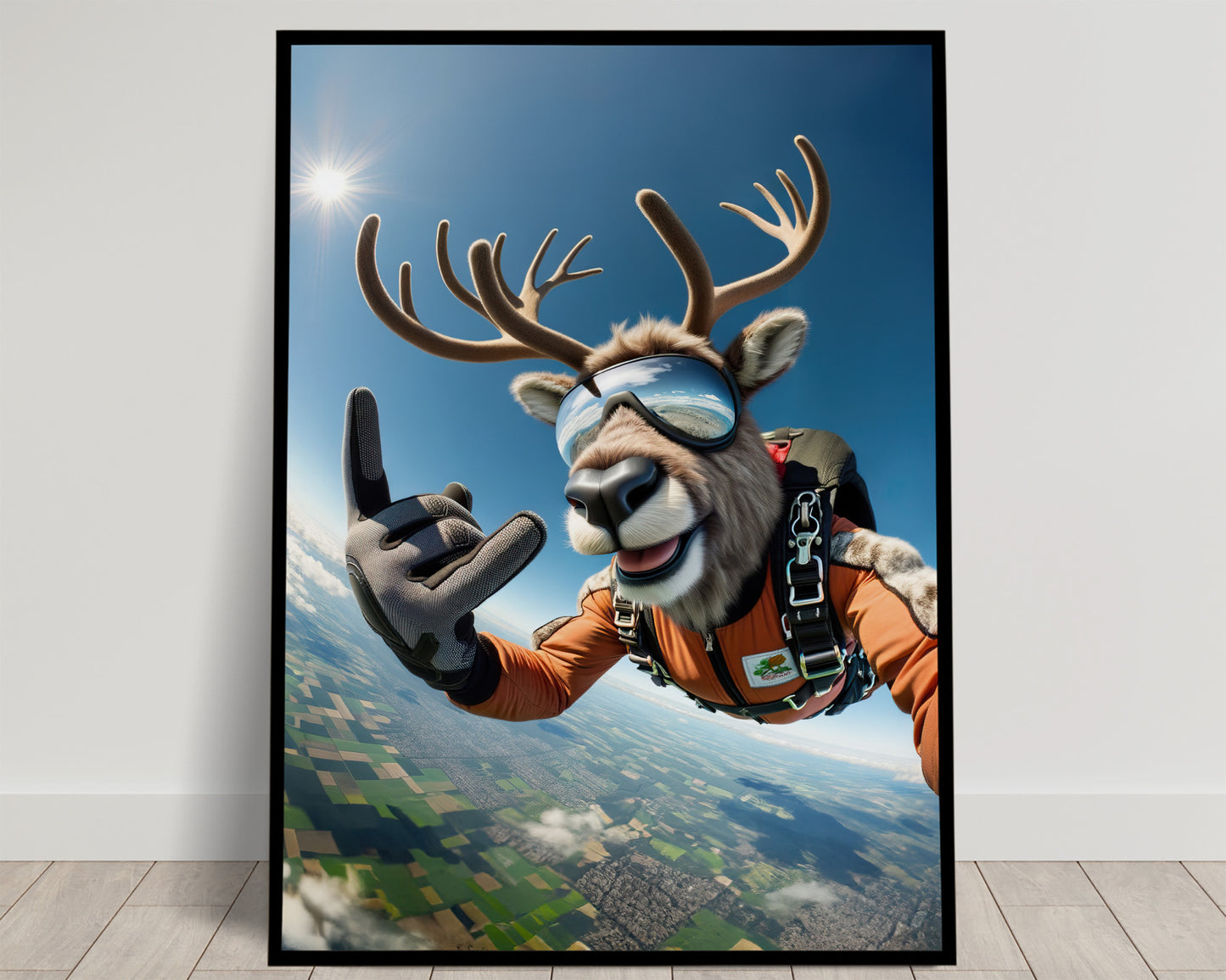 Smiling caribou skydiving in goggles and an orange jumpsuit, green countryside far below, Balthazart Studio poster
