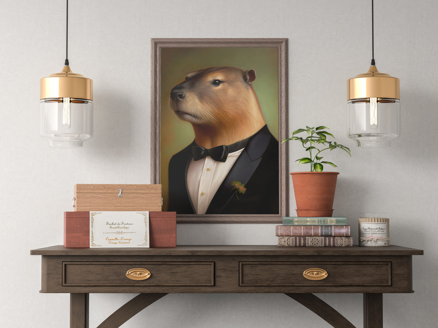 Capybara in tuxedo poster in a dark wood frame above a console between two gold pendant lights