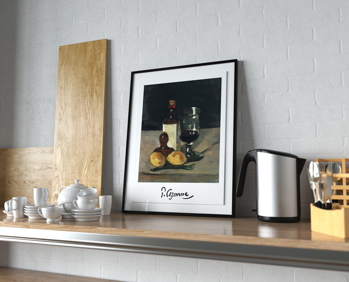 Affiche Cézanne nature morte aux citrons, cadre noir et passe-partout, posée sur un plan de travail de cuisine