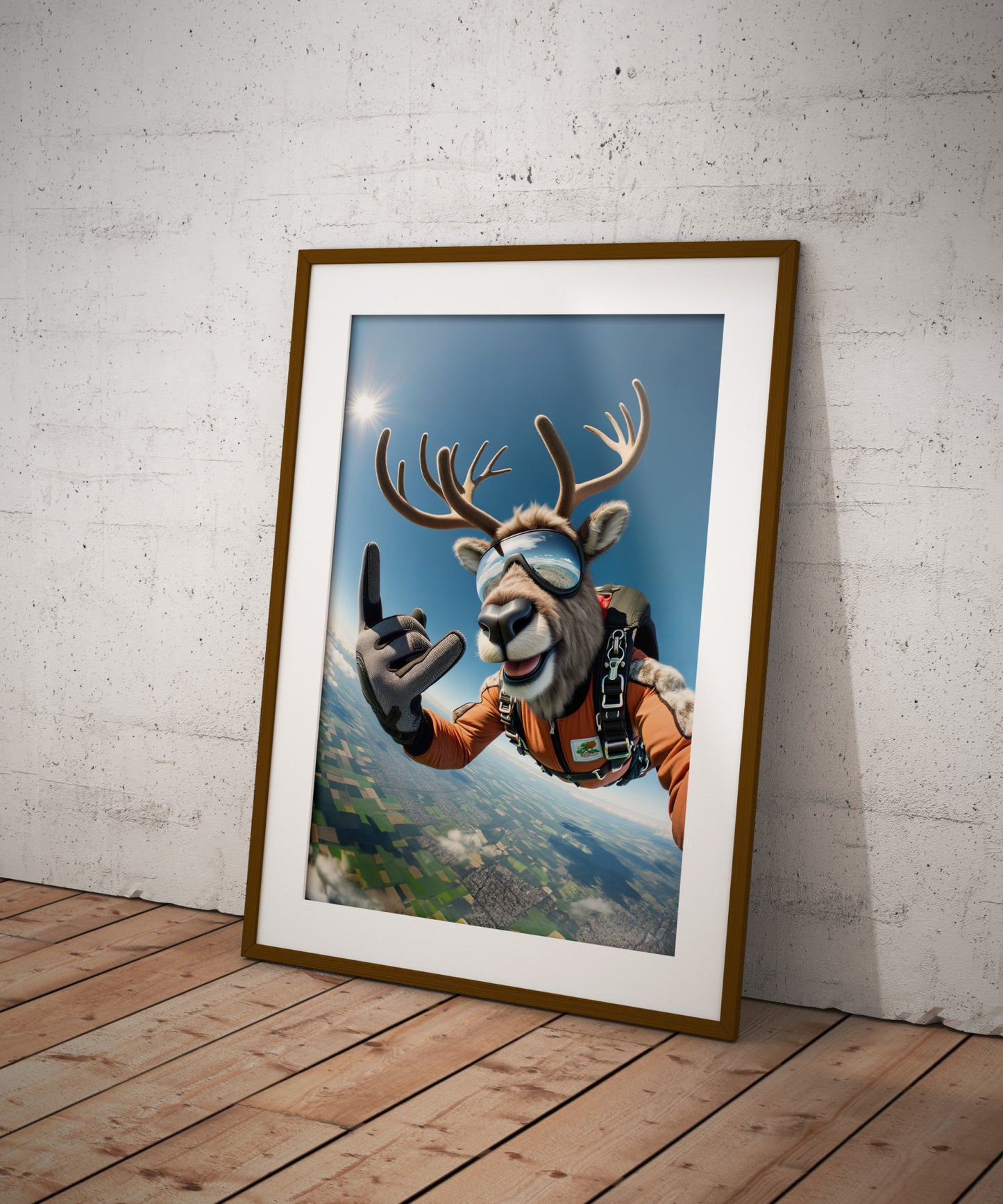 Skydiving caribou poster in a dark wood frame with white mat on a wooden floor