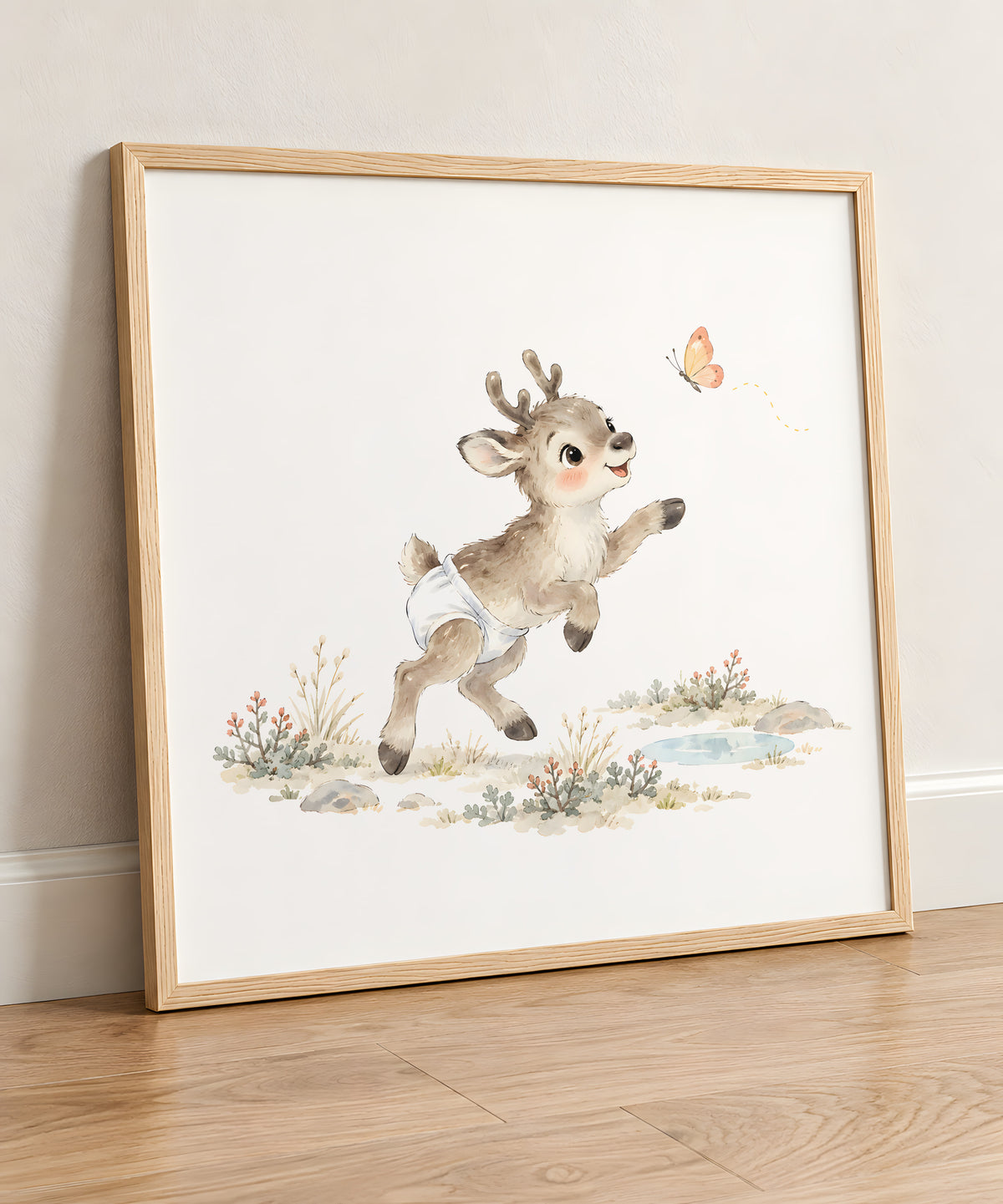 Baby Reindeer Tries to Catch a Butterfly Among the Grasses: natural wood frame, 50 × 50 cm, styled in a room
