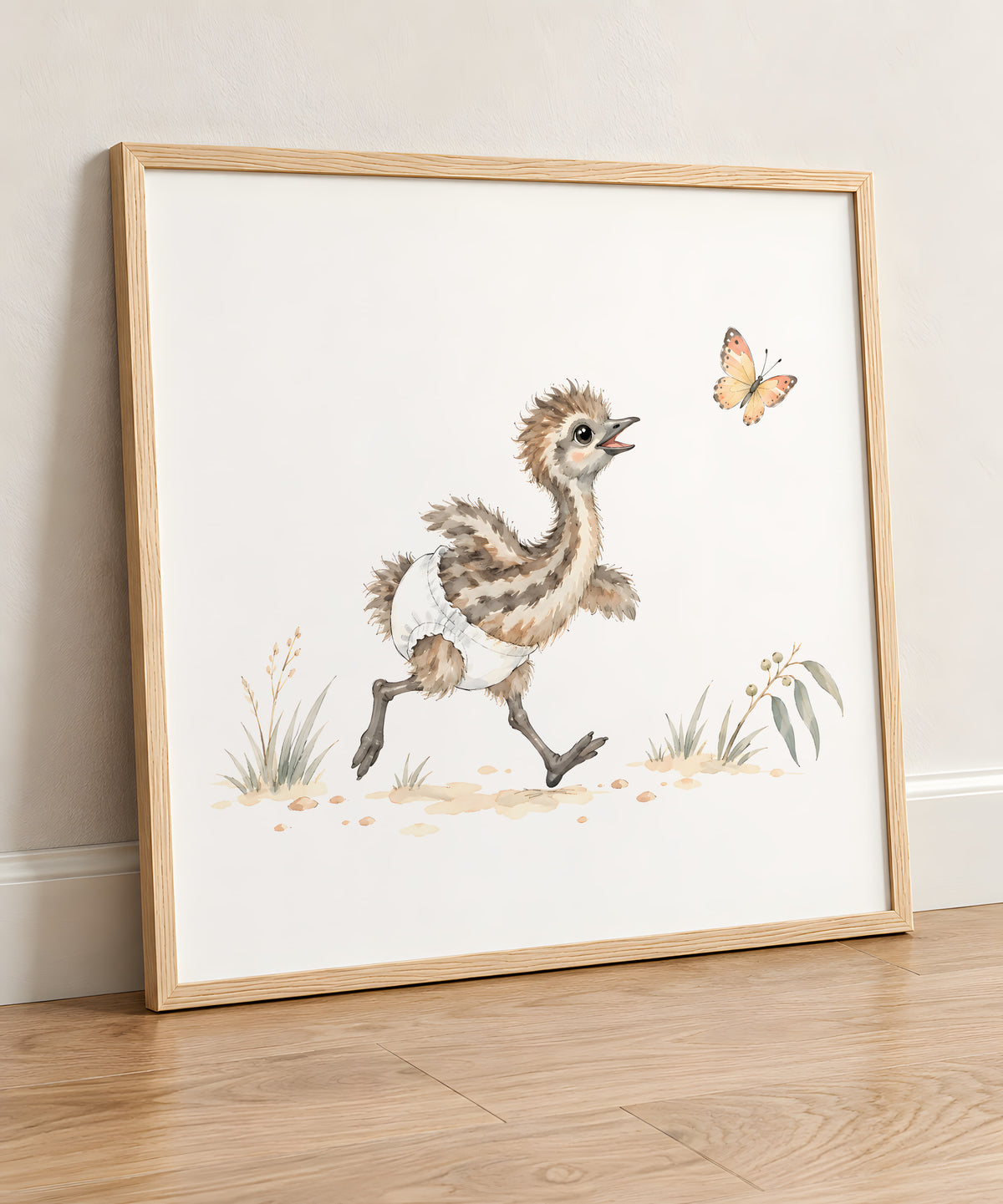 Baby Emu in a White Diaper Follows a Butterfly Through the Grass: natural wood frame, 50 × 50 cm, styled in a room