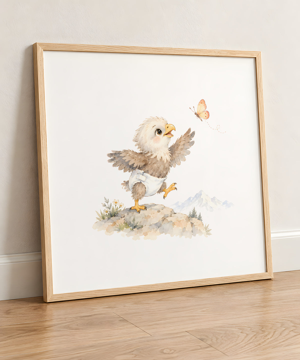 Aiglon en couche blanche déployant ses ailes pour attraper un papillon : cadre bois clair, 50 × 50 cm, en situation