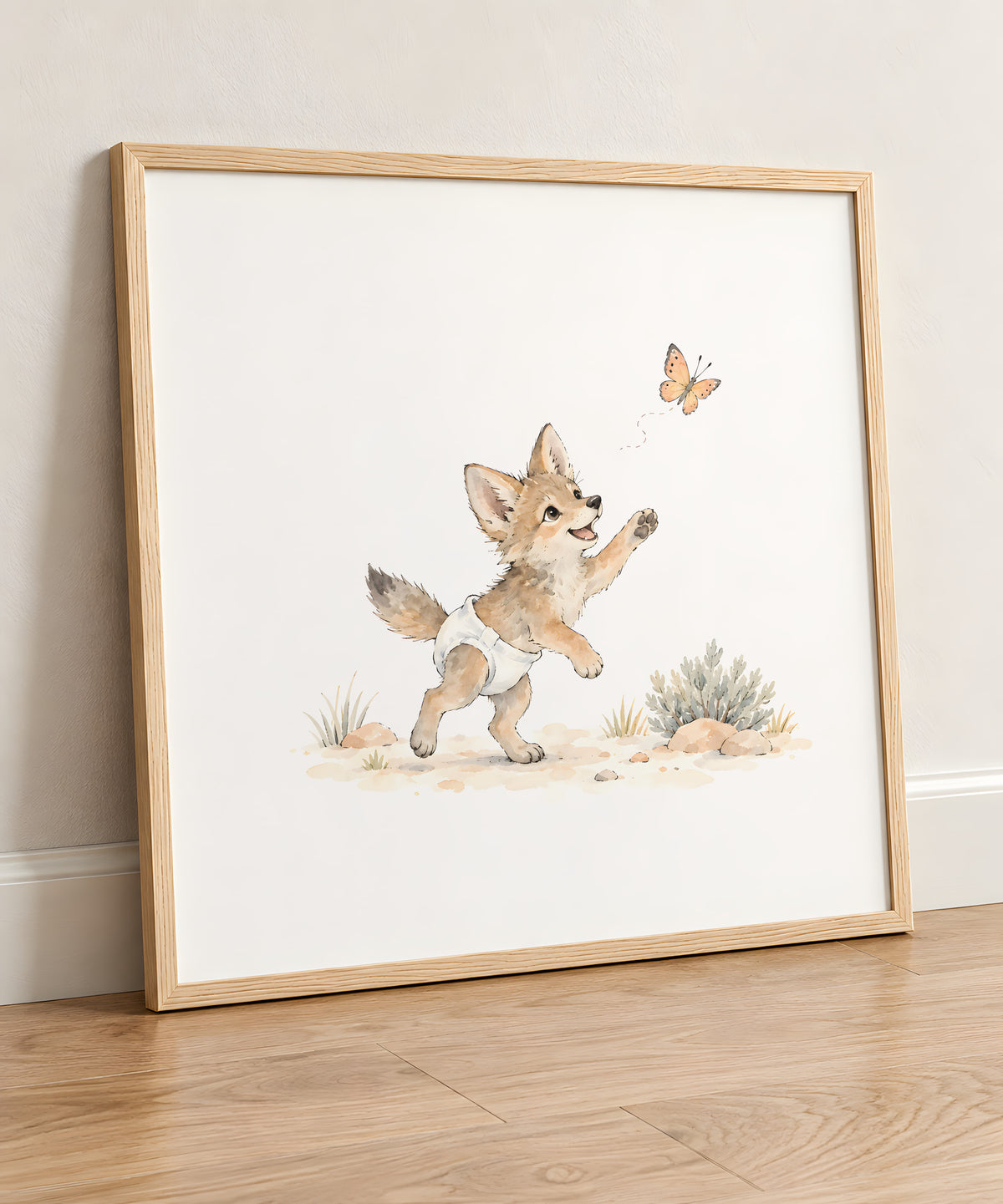 Baby Coyote in a White Diaper Follows a Butterfly Through the Grass: natural wood frame, 50 × 50 cm, styled in a room
