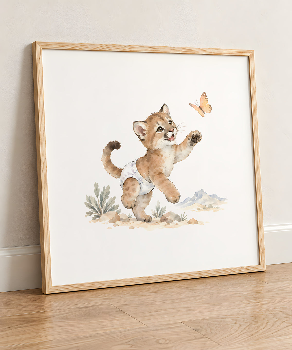 Baby Puma in a White Diaper Reaches for a Butterfly: natural wood frame, 50 × 50 cm, styled in a room