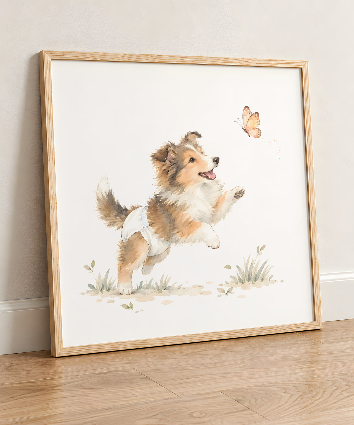 Chiot colley en couche blanche à la découverte d’un papillon : cadre bois clair, 50 × 50 cm, en situation