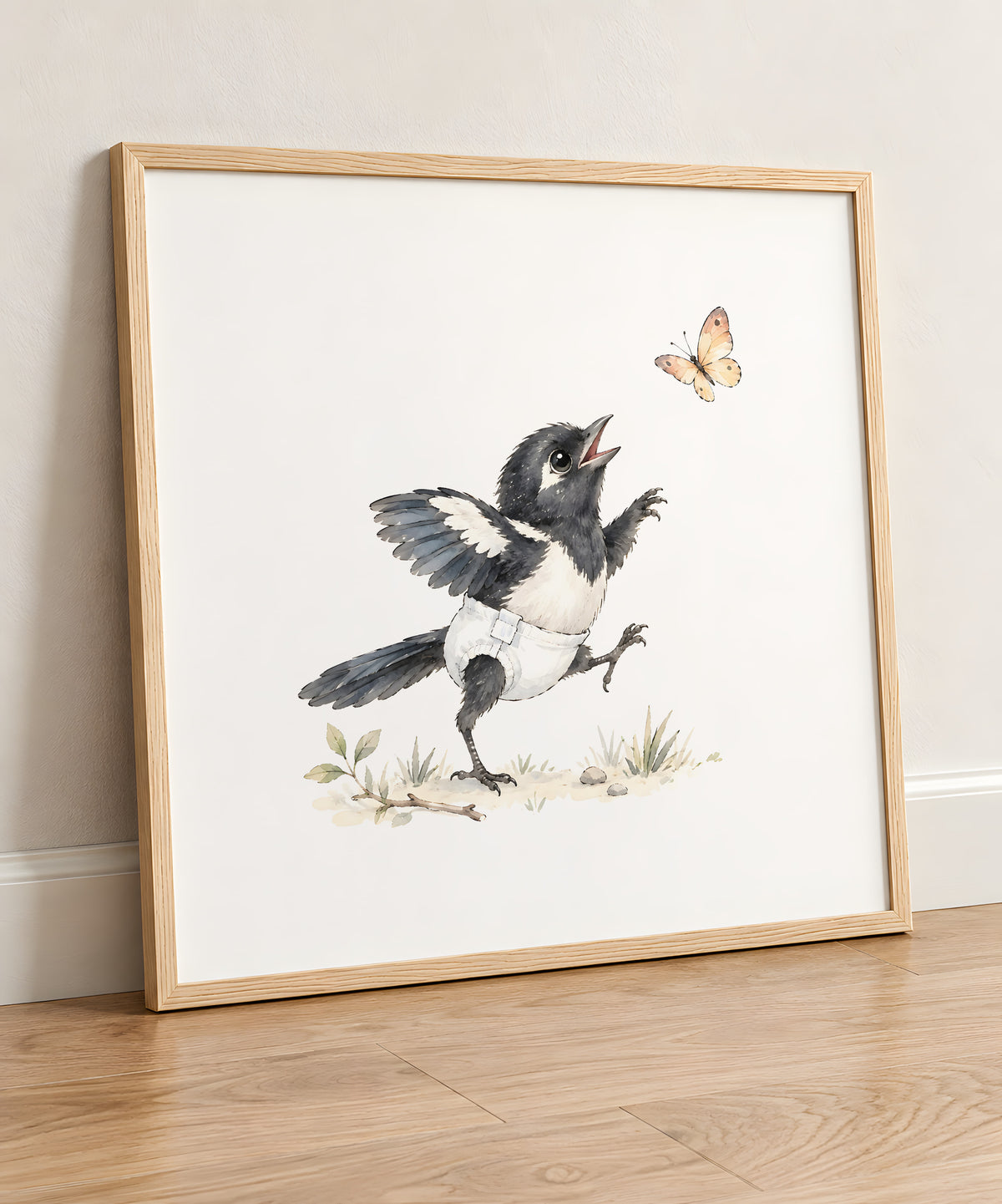 Baby Magpie in a White Diaper Chasing a Butterfly: natural wood frame, 50 × 50 cm, styled in a room
